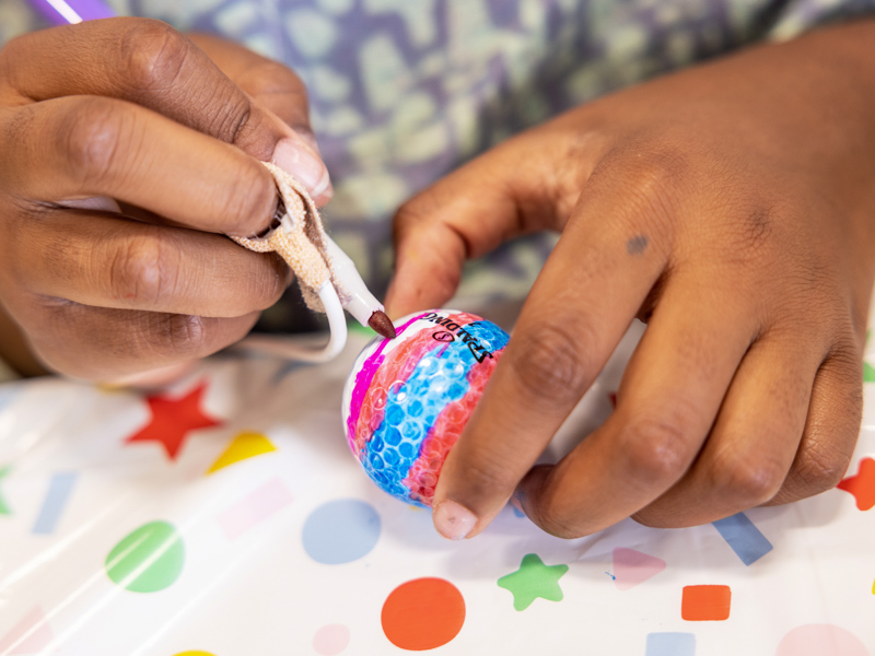 Children's of Mississippi patients created designs on golf balls during a visit from the PGA TOUR Wives Association during the Sanderson Farms Championship. Jay Ferchaud/ UMMC Photography